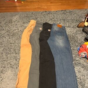 Carhart pants and 1 set of jeans